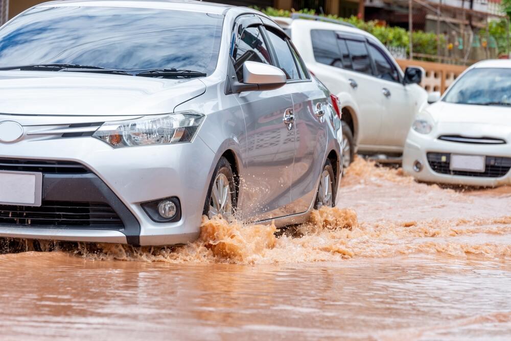 If you have to drive through water, what should you do? For maximum safety?